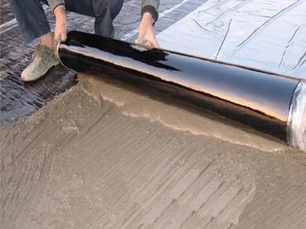 Self adhesive wet laid waterproof membrane